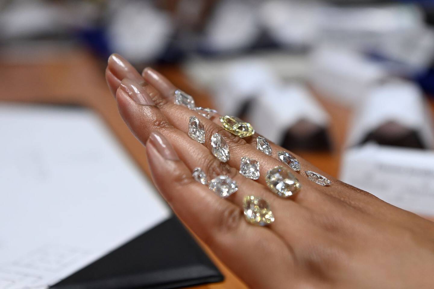 A person sketches out out an engagement ring design concept by hand